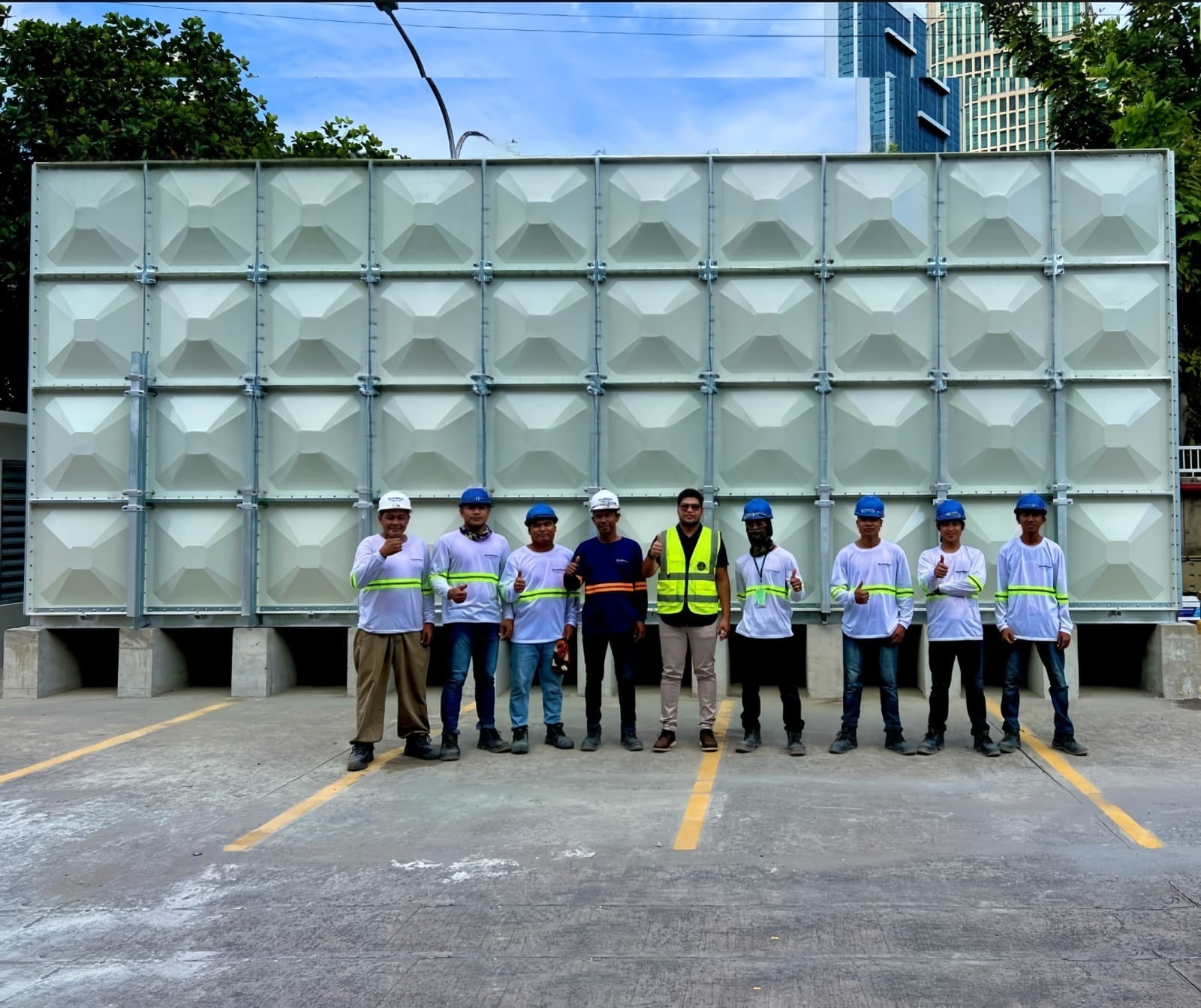 TankSmith installation team with completed FRP panel tank