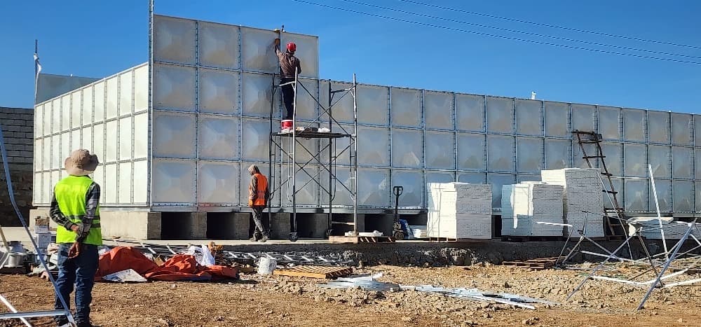 FRP water tank replacement and expansion panel assembly