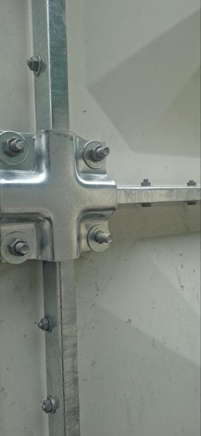 Hot-dip galvanized tie rod joint on the outside of the GRP tank wall